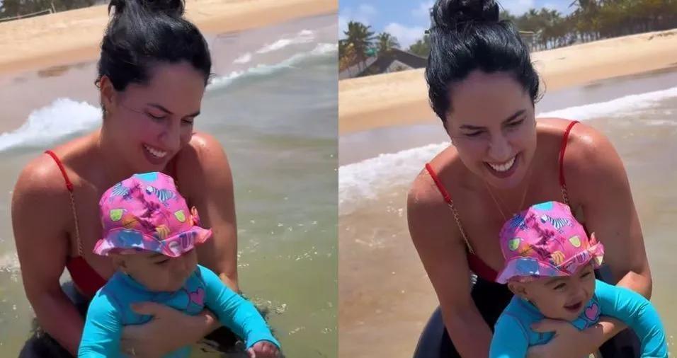 Graciele Lacerda registra primeiro mergulho da filha Clara no mar
